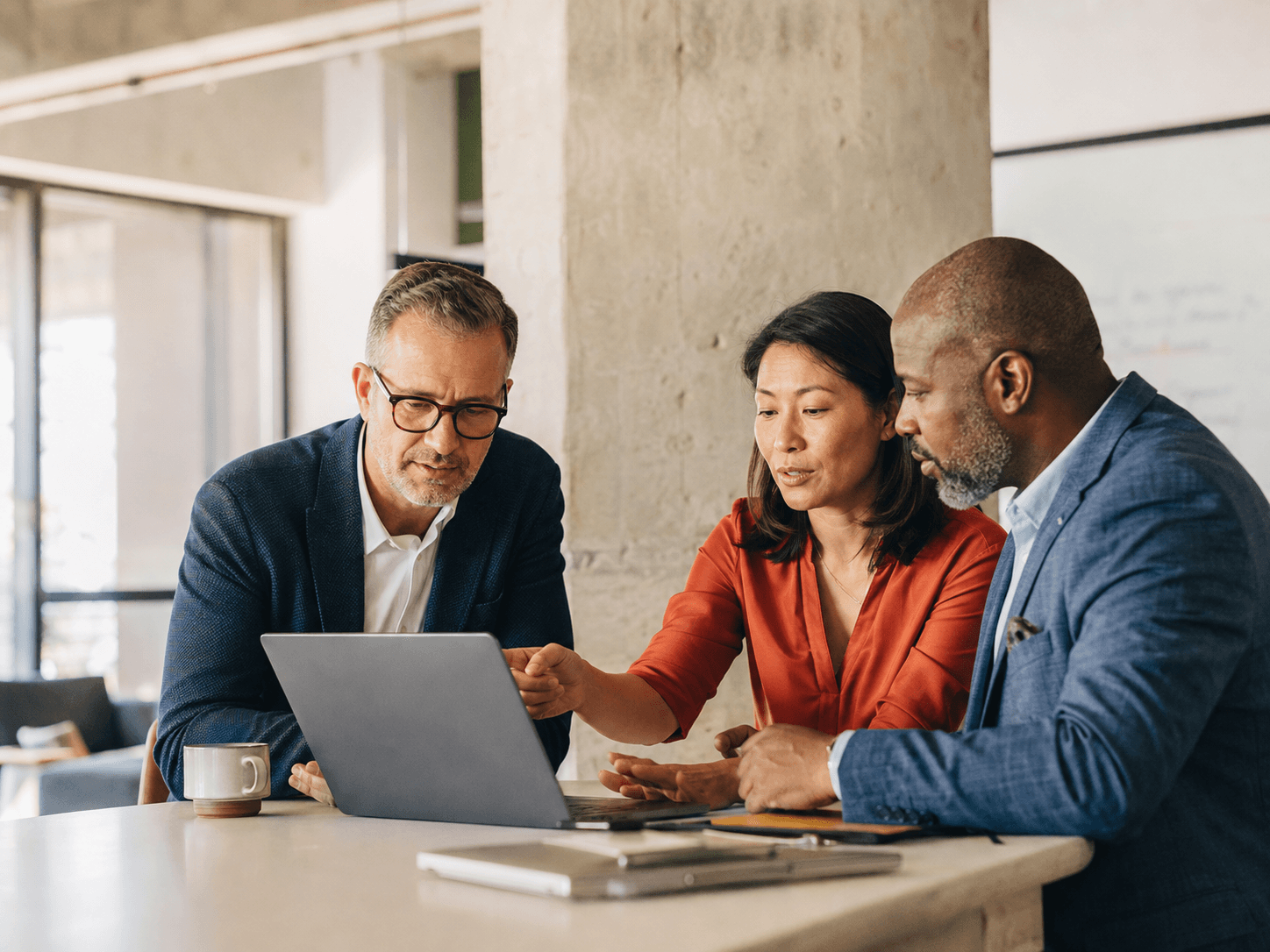 A client and technology team reviewing their work together